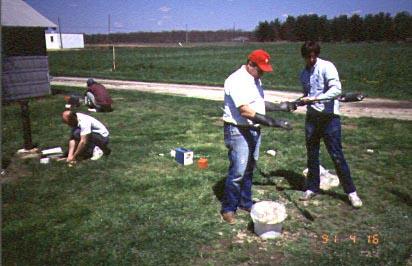 Scientists gathering ground water data from wells