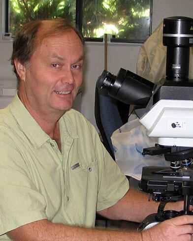 Carter Atkinson at microscope