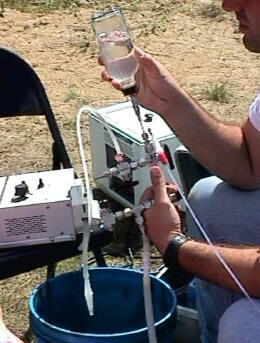 USGS scientists collecting water-quality samples as part of a long-term investigation of natural biodegradation