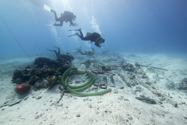 National Park Services (NPS) archaeologists survey the wreck of the HMS Fowey 