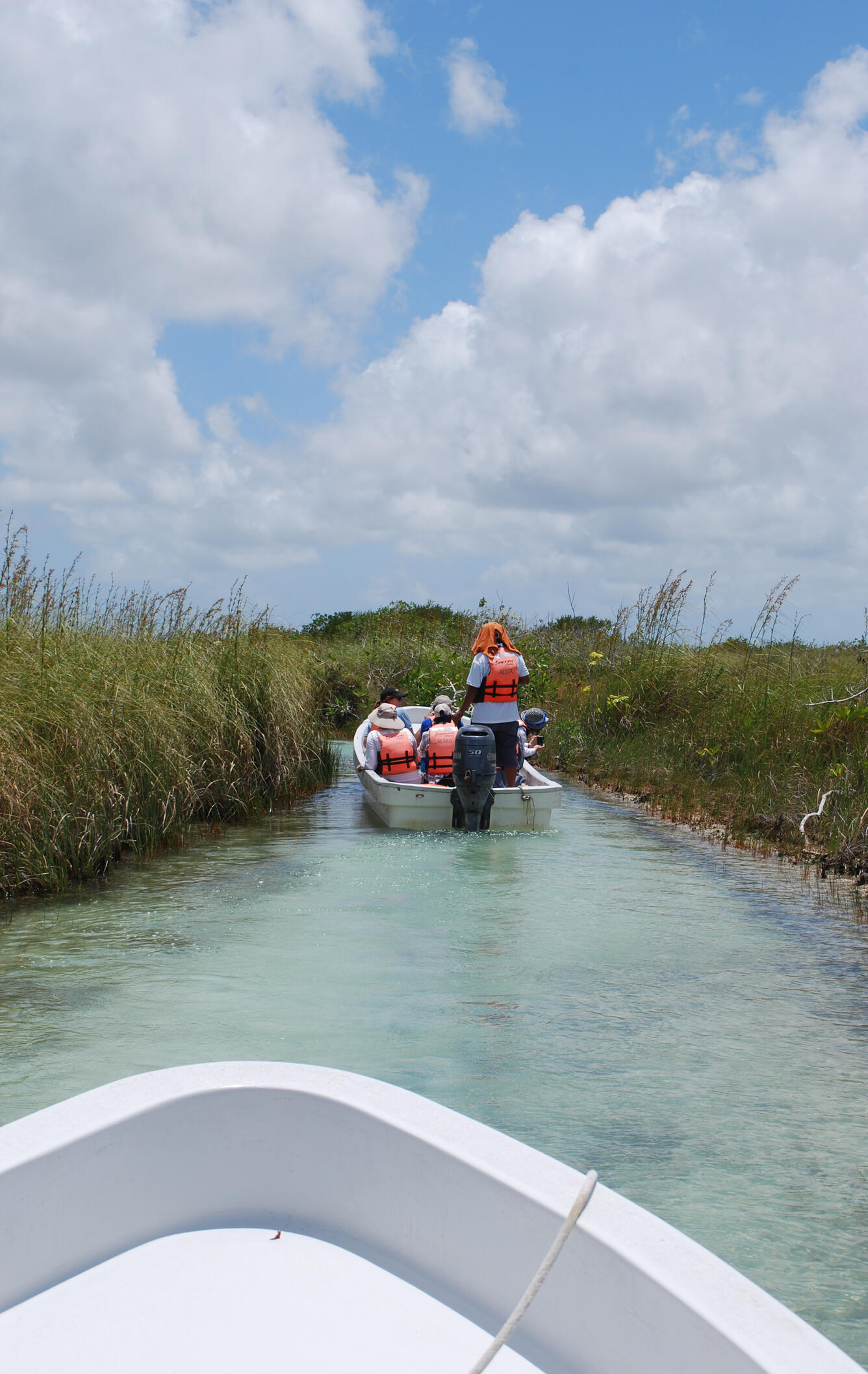 USGS field crew on a boat supporting Blue Carbon research.