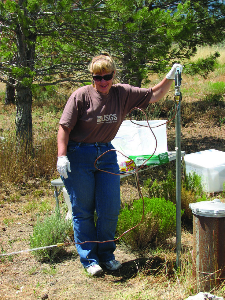 A domestic well being monitored by a hydrologic technician