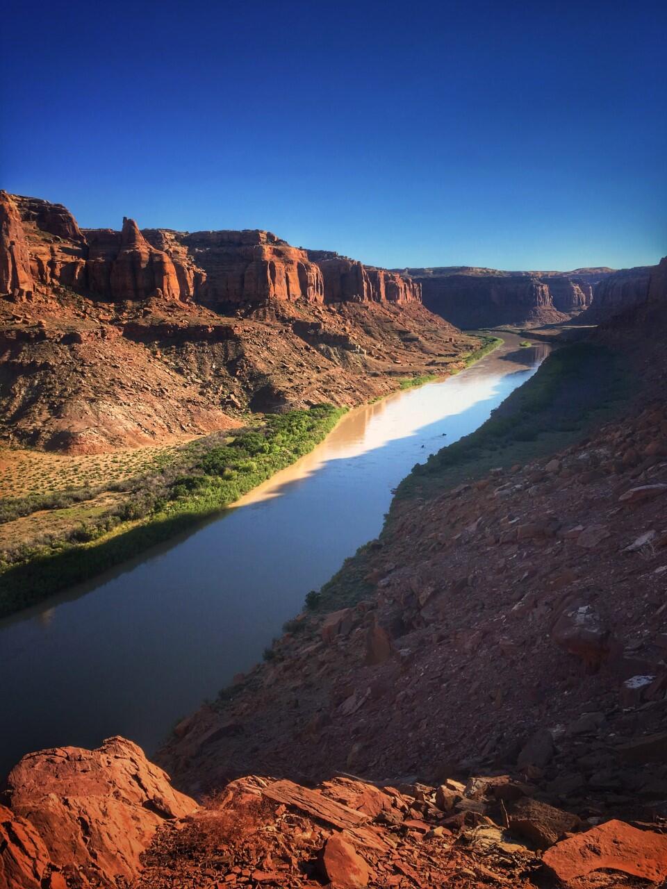 Sunlight on red cliffs and river