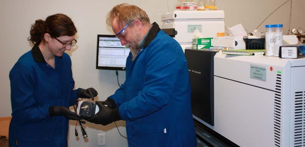 USGS scientists evaluating the nebulizer assembly in a mixed mode ionization source of a triple quadrupole mass spectrometer