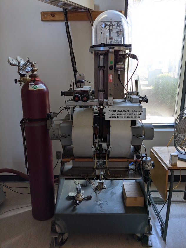 A complicated electronic balance sits in front of a window, looking like the robot from Lost In Space (complete with clear dome)