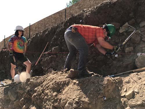 Scientists remove rocks to expose trench wall