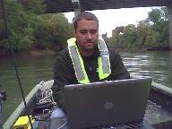 Donnie Keeling (OKI WSC) making a measurement from a boat