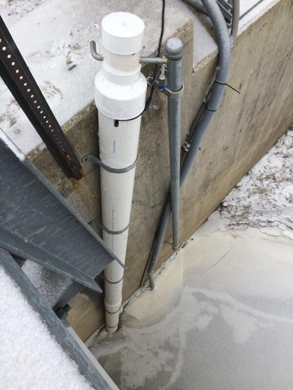 Eagle Creek above Findlay OH - equipment pipes down bridge side