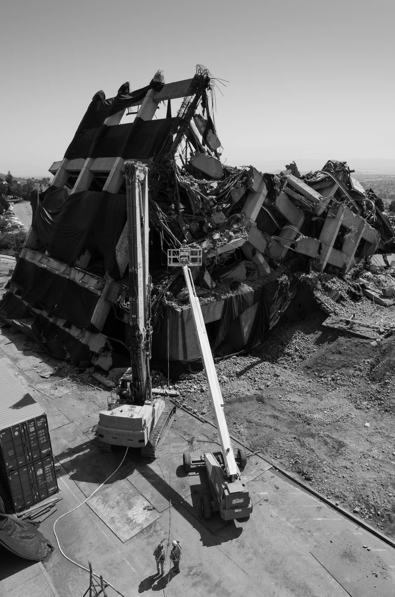 In the days following the implosion, demolition crews work to dismantle the remainders of the structure.