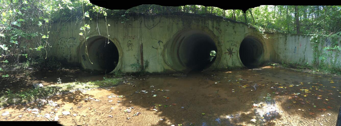 Culvert on Flat Creek installed for a new road crossing, the culvert forms a potential barrier to fish movement and recolonizati