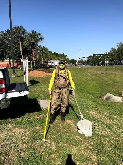 Scientist prepares for backpack electrofishing