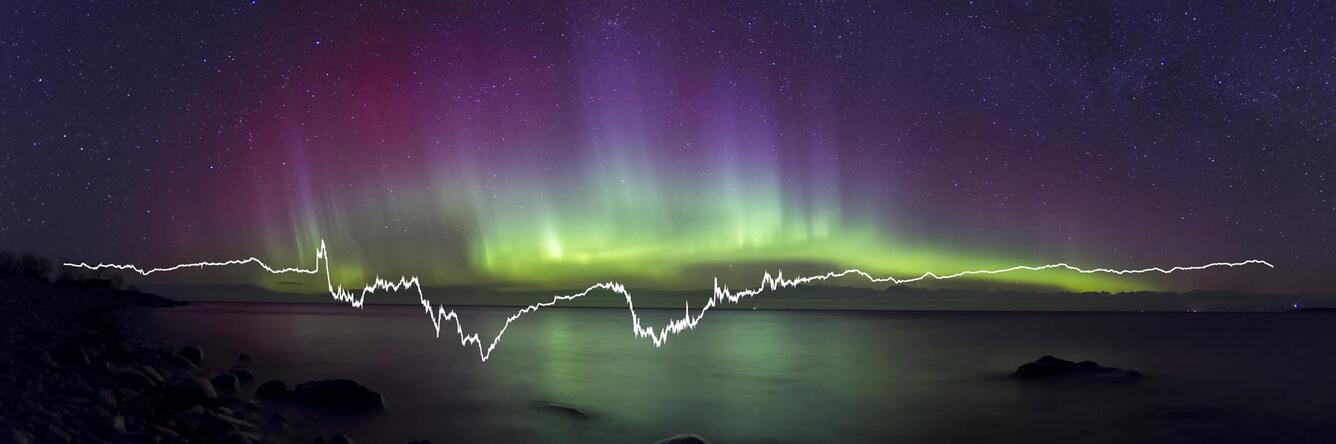 colorful lights on the horizon in the night sky