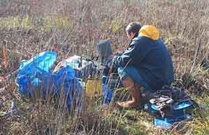 BRGM Scientist operates computer during field experiment