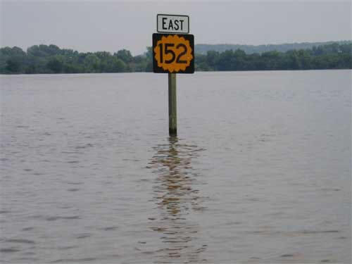 Flood water with a Highway 152 sign sticking out June-July 2007