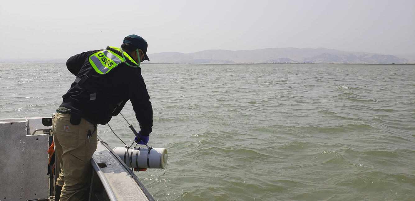 A hydrologic technician seen sampling water in the Sacramento-San Joaquin Delta