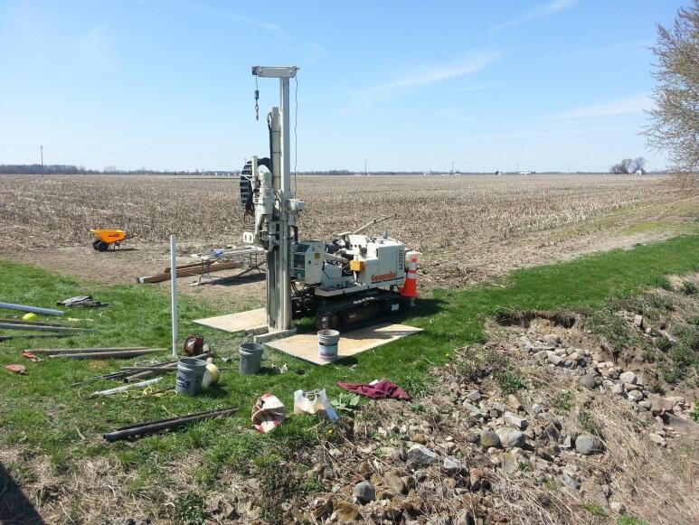 Drilling monitoring well at edge of farm, School Branch, IN