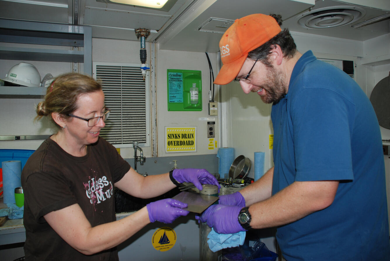 Amanda Demopoulos and Jason Chaytor section a sediment core 