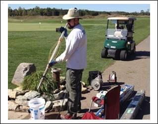 Dave Lampe making groundwater field measurement