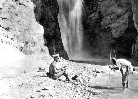 E.C. LaRue using a current meter to measure stream flow