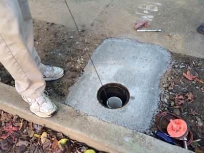 Mike Unthank measuring Bellevue well - Northern Sanitation District No 1