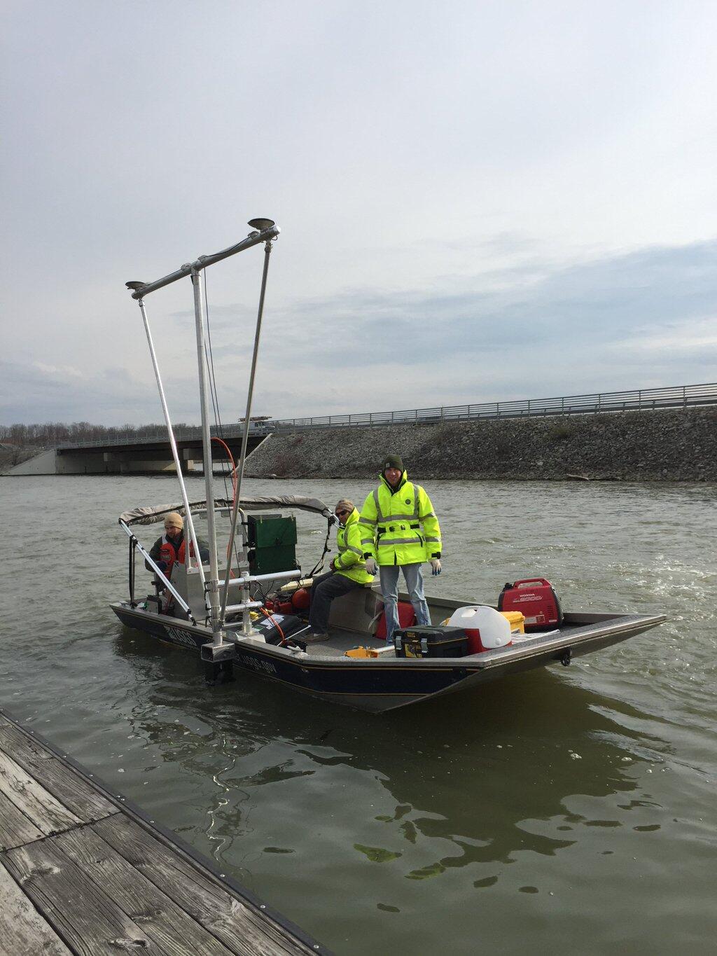 USGS scientists on a boat collecting multi-beam bathymetry data from Geist Reservoir