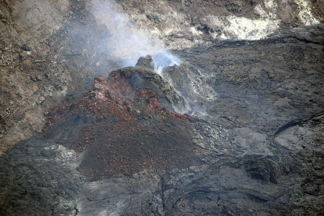 Color photograph of lava lake and vent