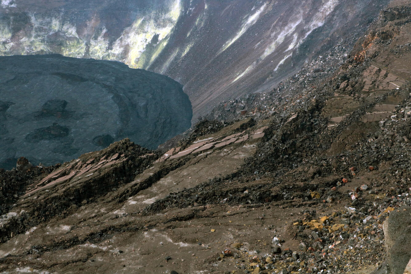 Portions of Crater Rim Drive, damaged during the 2018 Kīlauea summit collapse, are visible from the south rim of Halema‘uma‘u