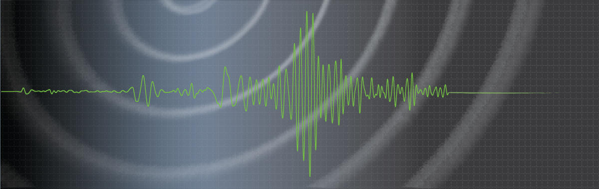 dark background with grid, wavefronts, and a green waveform