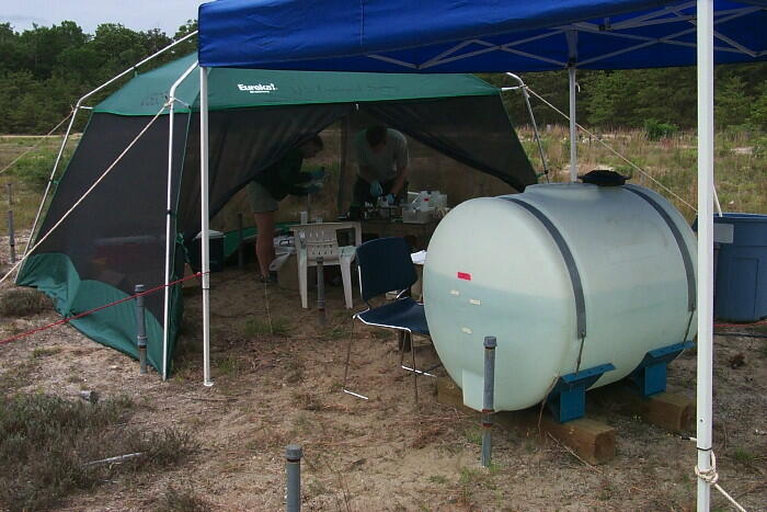 USGS scientists processing groundwater samples during a subsurface pH modification experiment