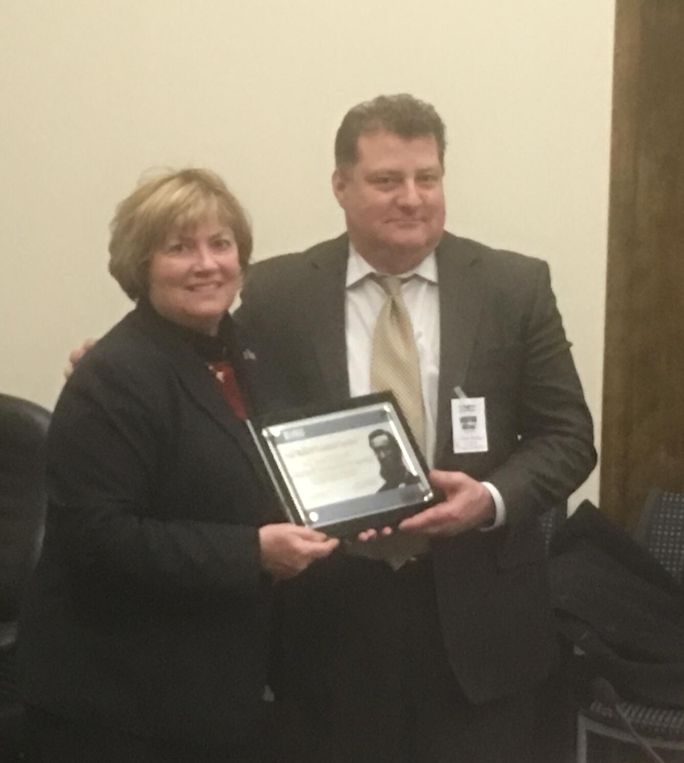 Suzette Kimball, Director of the U.S. Geological Survey presenting award to Nicholas Mastrodicasa