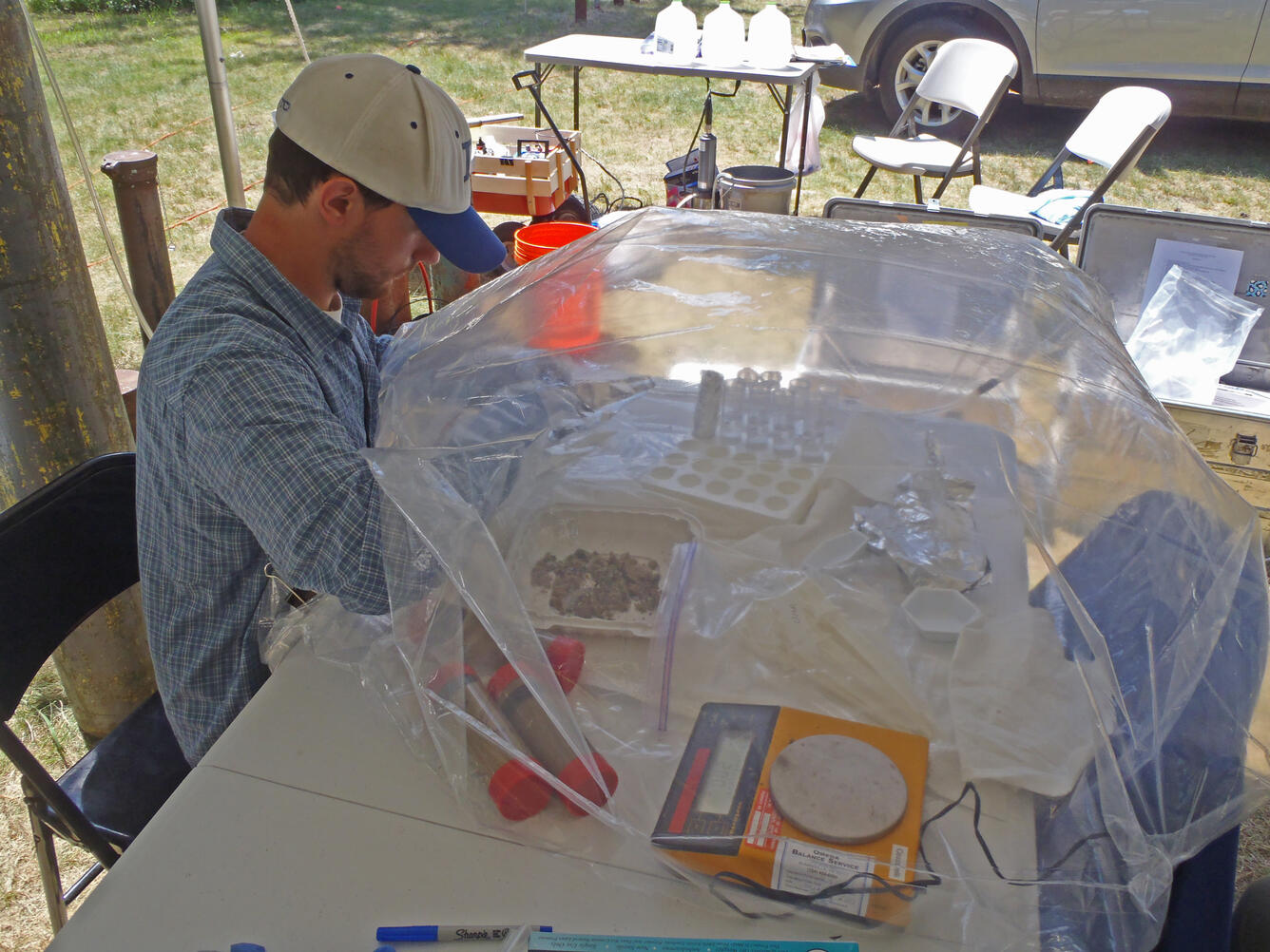 A scientist completes anaerobic processing of sediment from selected core depths prior to geochemical analyses