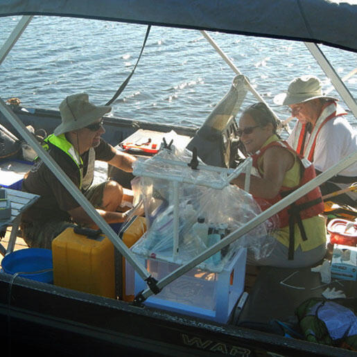 USGS staff collecting water-column samples on Bushy Park Reservoir.