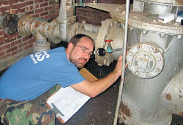 USGS Hydrologist collecting data from a groundwater production well in the Chesterfield County study area