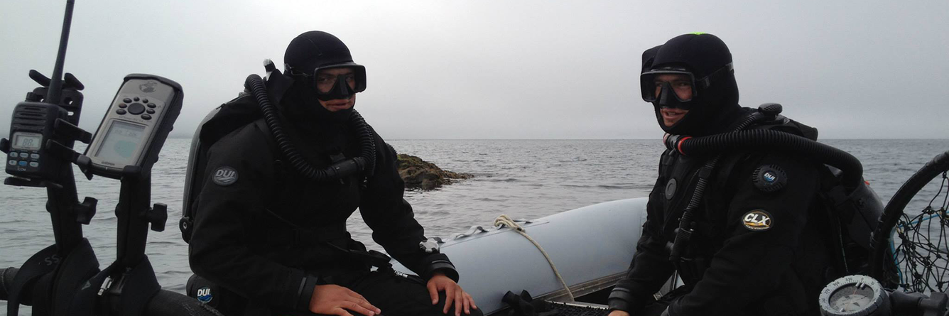 USGS divers heading out in a skiff to look for Sea Otters