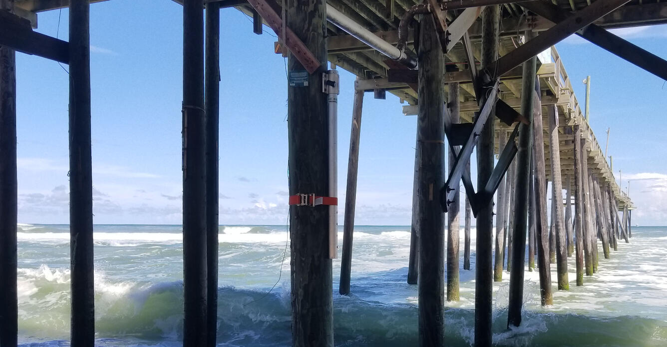 Storm sensor mounted to pier, along Carolina coast