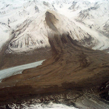Photograph showing a large rock avalanche in the Alaska Range triggered by the November 3, 2002