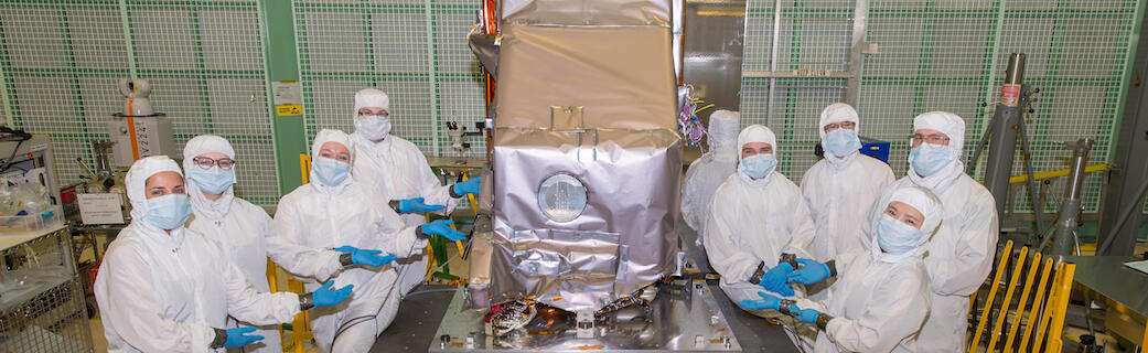 Engineers pose with the TIRS-2 instrument