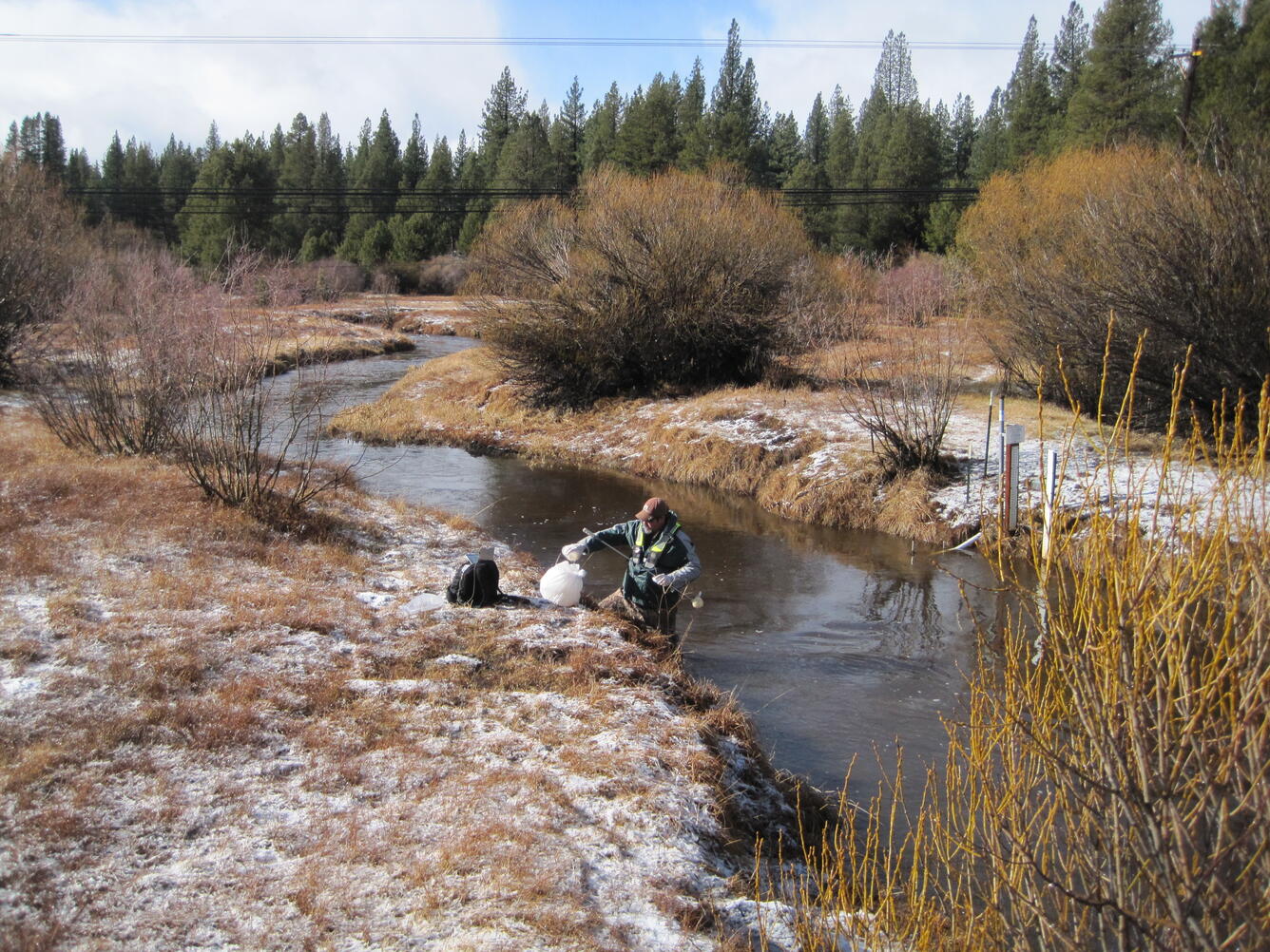 USGS scientist collecting water-quality samples from Trout Creek near Tahoe Valley, CA