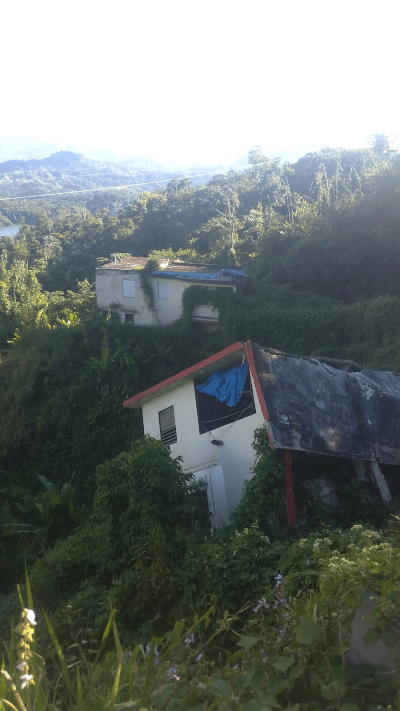 A house in Puerto Rico damaged by a landslide. USGS photo by Lindsay Davis