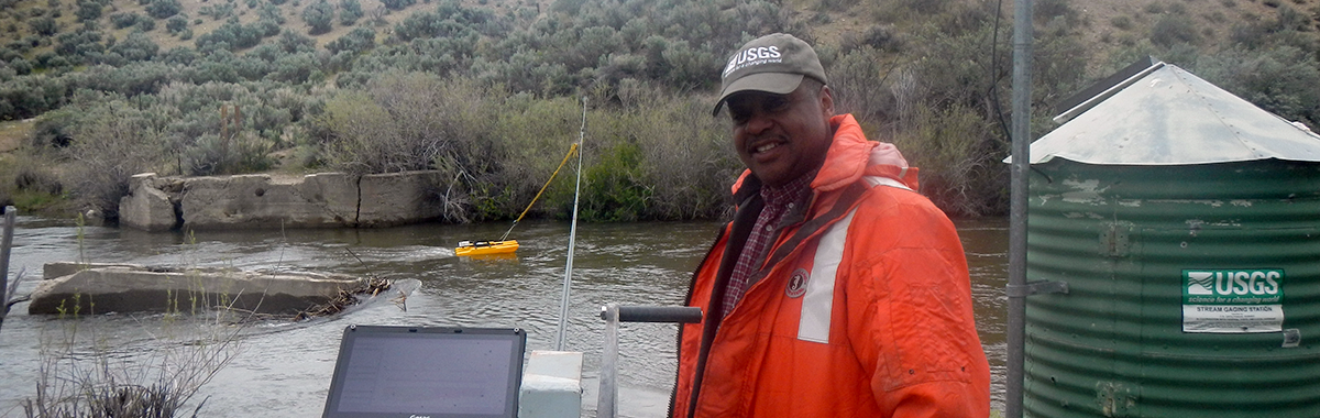 USGS scientist Joe Joyner using an ADCP for a stream discharge measurement on the Walker River, Nev.