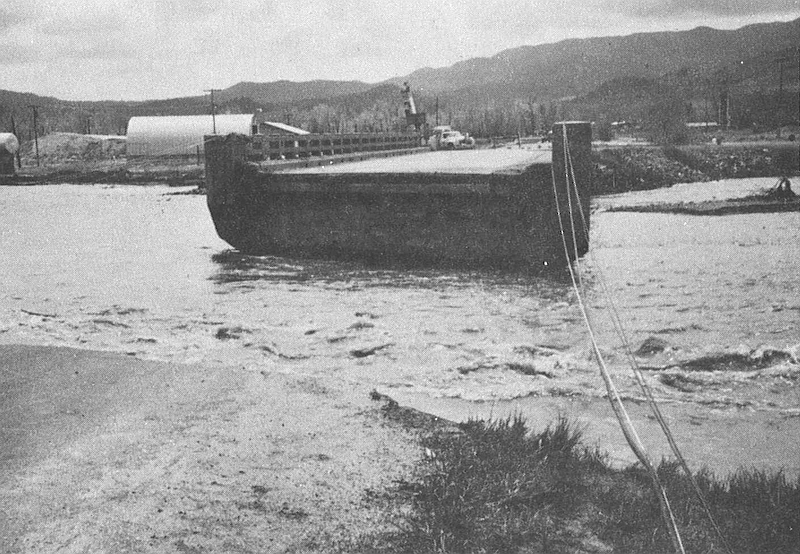 Washed-out road approach on State Highway 69
