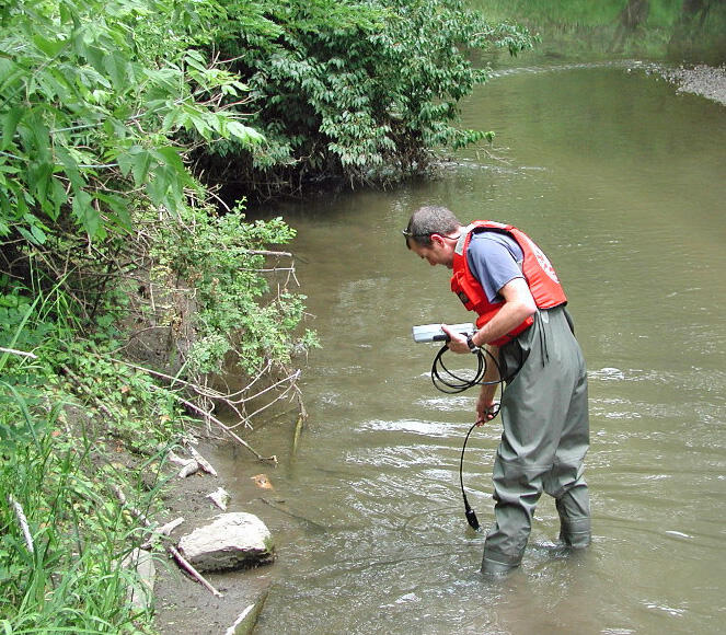 USGS scientist determining if enough dissolved oxygen is present for biodegradation of hormones in Fourmile Creek, Iowa. 
