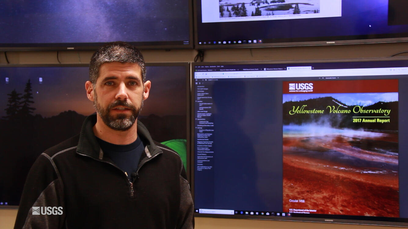 Man standing in front of TV