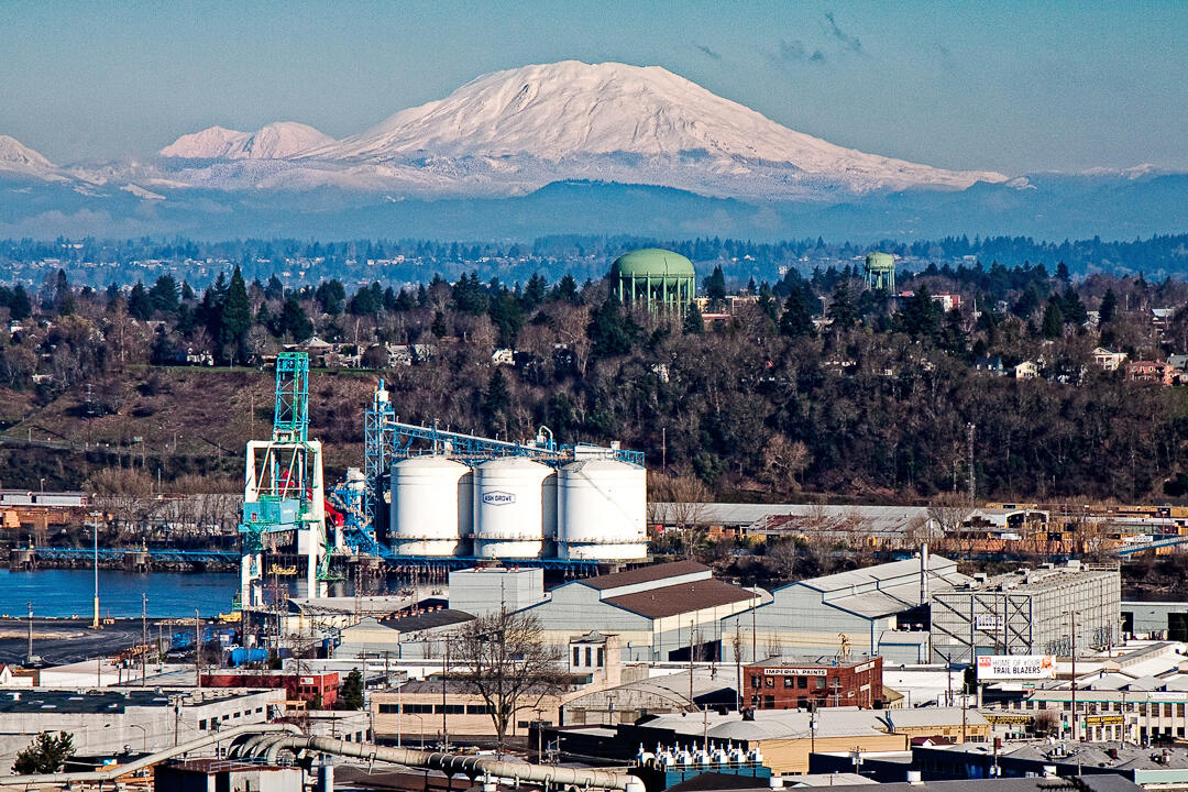 Mount St. Helens and the industrial waterfront area of North Portla...