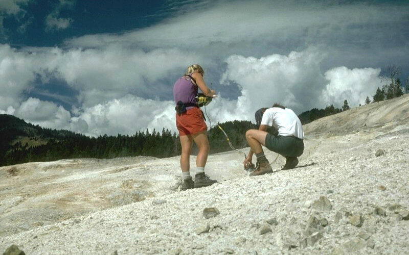 Scientists take gas samples at Washburn Hot Springs to measure sulf...