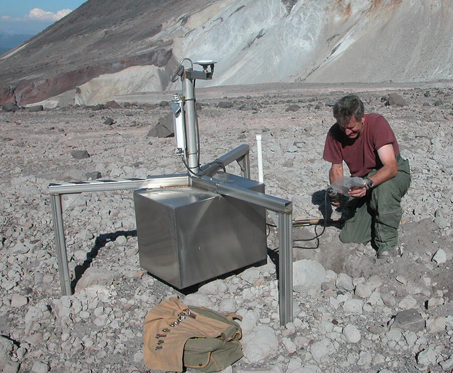 Deploying spider volcano-monitoring equipment in the crater of Moun...