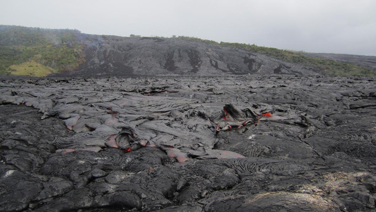 pāhoehoe flows spreading on the coastal plain about 0.6 km from the...