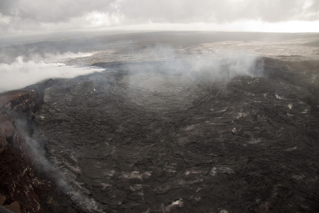 Lava lake in Pu‘u ‘Ō‘ō, and surface lava on episode 61 flow field...