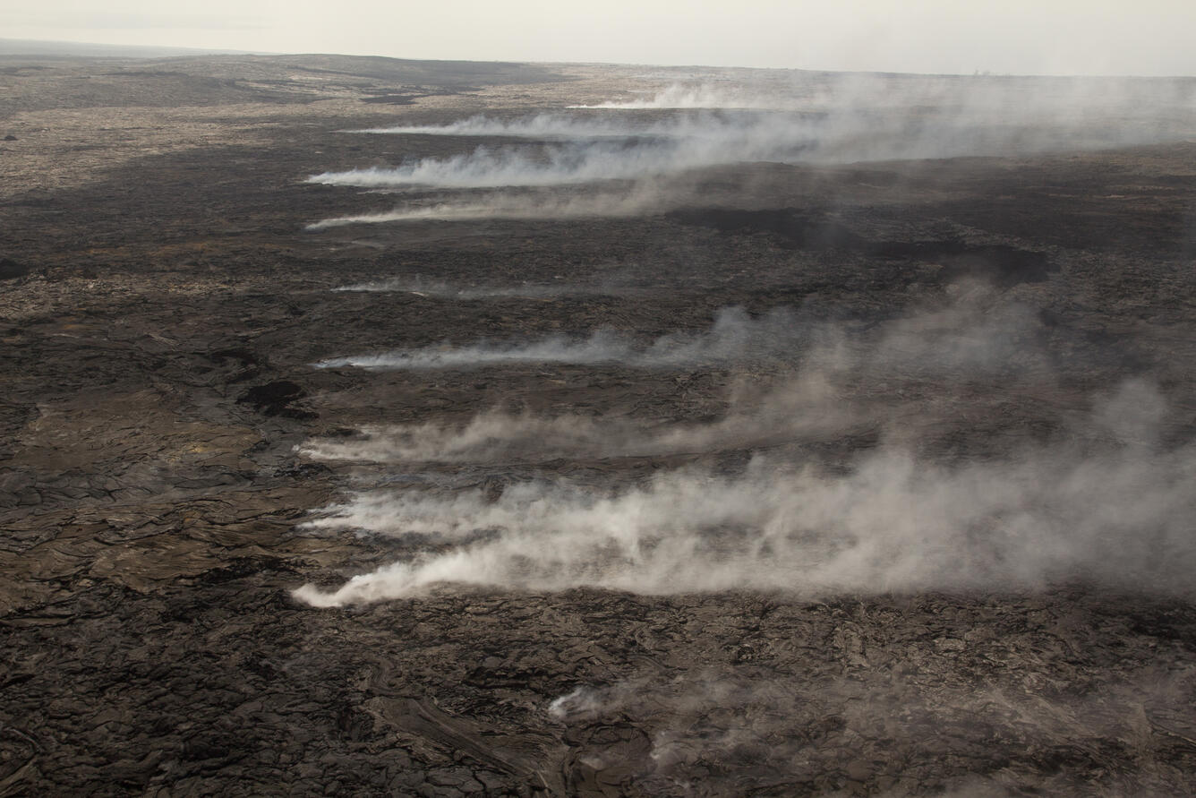 Looking downslope, numerous fume sources provide a clear trace of t...