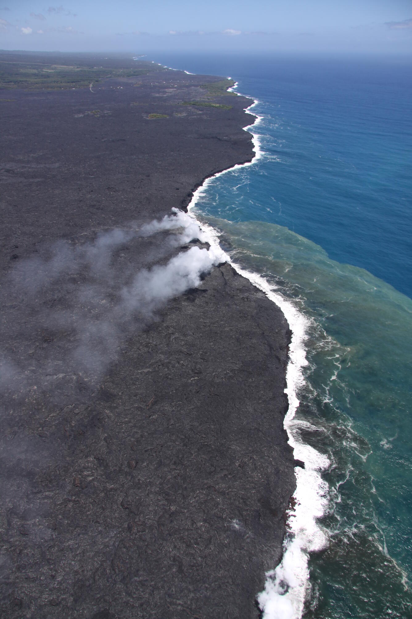 View looking northeast towards Kalapana from the ocean entry. The ...